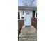Inviting front entrance with light blue door and welcoming mat at 11 Eastridge Dr, Greenwood, IN 46143