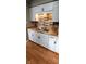 Modern kitchen with white cabinets, wood countertops, and double sink at 11 Eastridge Dr, Greenwood, IN 46143
