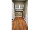 Laundry room with upper cabinets and wood-look flooring at 11 Eastridge Dr, Greenwood, IN 46143