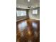 Spacious living room with hardwood floors and large windows at 11 Eastridge Dr, Greenwood, IN 46143