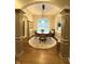 Elegant dining room featuring wood floors, arched doorways, and classic design at 11253 Loch Raven Blvd, Fishers, IN 46037