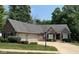 Charming brick home with a well-manicured lawn, two-car garage, and lush landscaping at 11253 Loch Raven Blvd, Fishers, IN 46037