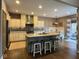 Modern kitchen featuring a large island, granite countertops, and stainless steel appliances at 11253 Loch Raven Blvd, Fishers, IN 46037