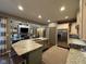 Gourmet kitchen with island and adjacent living room perfect for hosting gatherings at 11253 Loch Raven Blvd, Fishers, IN 46037