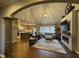 Open-concept living room with vaulted ceilings, fireplace, and wood floors, perfect for entertaining at 11253 Loch Raven Blvd, Fishers, IN 46037