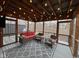 Inviting screened porch featuring wood ceiling, string lights, comfortable seating, and a view of the yard at 11253 Loch Raven Blvd, Fishers, IN 46037