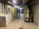 Unfinished basement with laundry hookups and water heater at 116 Kenova Dr, Indianapolis, IN 46227