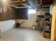 Unfinished basement with shelving and workspace at 116 Kenova Dr, Indianapolis, IN 46227