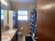 Bathroom with pink tile, bathtub, and double sink vanity at 116 Kenova Dr, Indianapolis, IN 46227