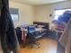 Bedroom with a double bed, office chair, and hardwood floors at 116 Kenova Dr, Indianapolis, IN 46227