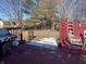 Red wooden deck with grill and backyard access at 116 Kenova Dr, Indianapolis, IN 46227