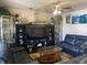Living room with leather sofas, large TV, and wooden coffee table at 116 Kenova Dr, Indianapolis, IN 46227