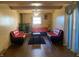 Spacious living room with red couches and a brick fireplace at 116 Kenova Dr, Indianapolis, IN 46227