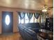 Living room features leather sofas and a large window at 116 Kenova Dr, Indianapolis, IN 46227