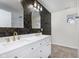 Elegant bathroom with double vanity, gold fixtures, and black floral wallpaper at 1238 Orchard N Park, Carmel, IN 46280