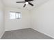 Simple bedroom with gray carpet, a ceiling fan, and a window with natural light at 1238 Orchard N Park, Carmel, IN 46280