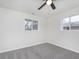 Spacious bedroom with neutral walls, gray carpet, and ceiling fan at 1238 Orchard N Park, Carmel, IN 46280