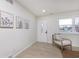 Light and airy entryway with a stylish chair, wood floors, and a white door at 1238 Orchard N Park, Carmel, IN 46280