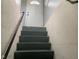 Basement stairs with metal railing at 12625 Strawtown Ave, Noblesville, IN 46060