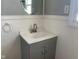 Updated bathroom with a gray vanity, oval mirror, and brushed nickel faucet at 12625 Strawtown Ave, Noblesville, IN 46060