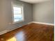 Spacious bedroom with hardwood floors and a large window at 12625 Strawtown Ave, Noblesville, IN 46060