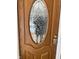 Wooden door with oval glass and keypad at 12625 Strawtown Ave, Noblesville, IN 46060