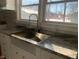 Modern stainless steel sink with a gooseneck faucet and granite countertop at 12625 Strawtown Ave, Noblesville, IN 46060