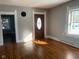 Living room with hardwood floors and neutral walls at 12625 Strawtown Ave, Noblesville, IN 46060