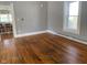 Hardwood floors and view into kitchen at 12625 Strawtown Ave, Noblesville, IN 46060