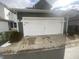 Two-car garage with white door and dark green exterior at 17389 Dallington St, Westfield, IN 46074