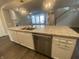 Kitchen island with granite countertop, sink, and dishwasher at 17389 Dallington St, Westfield, IN 46074