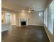 Living room with hardwood floors, fireplace, and large windows at 17389 Dallington St, Westfield, IN 46074
