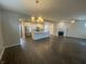 Open concept living room with hardwood floors and fireplace at 17389 Dallington St, Westfield, IN 46074