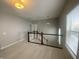 Upstairs hallway with carpet and staircase at 17389 Dallington St, Westfield, IN 46074