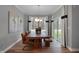 Bright dining room features a wood table, leather chairs, and access to the backyard at 19509 Mcbee Ave, Westfield, IN 46074
