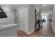 Clean and modern hallway with wood-look floors and built-in storage at 19509 Mcbee Ave, Westfield, IN 46074