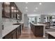 Open kitchen with island and stainless appliances at 19509 Mcbee Ave, Westfield, IN 46074