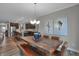 Open concept kitchen and dining area with modern appliances and hardwood floors at 19509 Mcbee Ave, Westfield, IN 46074