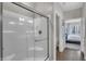 Clean bathroom featuring a glass-enclosed shower and dark wood floors at 196 Brunson St, Westfield, IN 46074