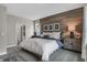 Bright bedroom with wood-paneled accent wall and natural light at 196 Brunson St, Westfield, IN 46074