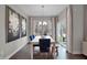Bright dining room with white table, blue chairs, and large windows at 196 Brunson St, Westfield, IN 46074