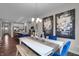 Bright dining room with white table, blue chairs, and large windows at 196 Brunson St, Westfield, IN 46074