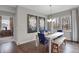 Bright dining room with white table, blue chairs, and large windows at 196 Brunson St, Westfield, IN 46074