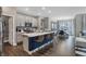 Modern kitchen with island, stainless steel appliances, and dark blue accents at 196 Brunson St, Westfield, IN 46074