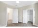 Well-lit bedroom with carpet, and doors to other rooms at 2215 Brookside Ave, Indianapolis, IN 46218