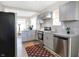Updated kitchen with gray cabinets, granite countertops, and stainless steel appliances at 2215 Brookside Ave, Indianapolis, IN 46218