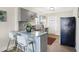 Modern kitchen with gray cabinets, granite countertops, and stainless steel appliances at 2215 Brookside Ave, Indianapolis, IN 46218