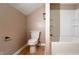 Bathroom with toilet and tub shower combo at 2502 N Harding N St, Indianapolis, IN 46208