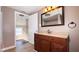Bathroom with vanity, mirror, and access to bedroom at 2502 N Harding N St, Indianapolis, IN 46208