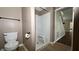 Clean bathroom with shower stall, toilet and modern fixtures at 2502 N Harding N St, Indianapolis, IN 46208
